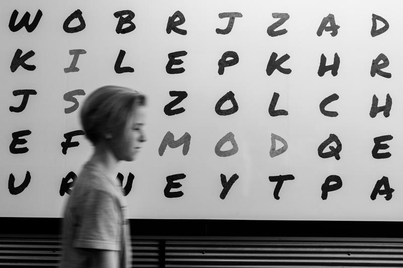 Boy in front of letters